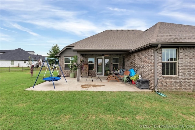 exterior space featuring a lawn, ceiling fan, and a patio area