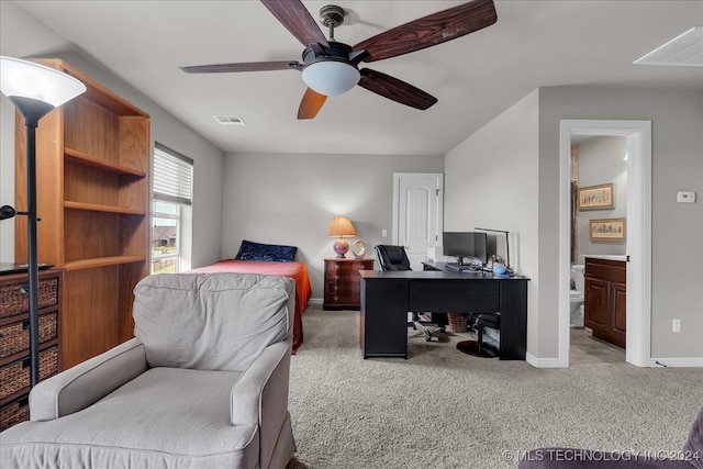 carpeted bedroom with ceiling fan and ensuite bathroom