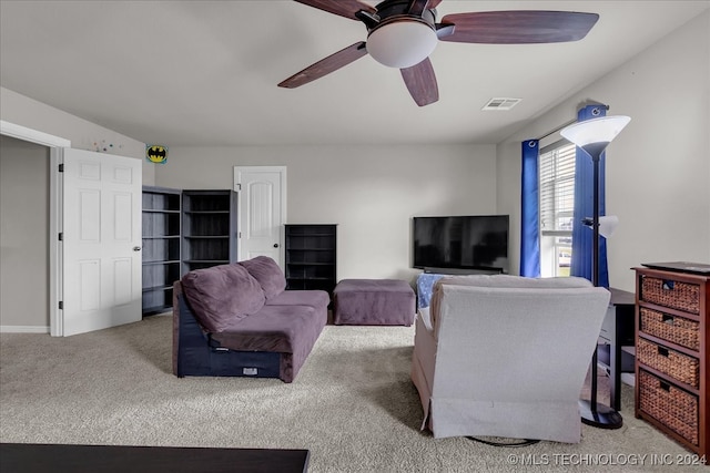 living room featuring light carpet and ceiling fan