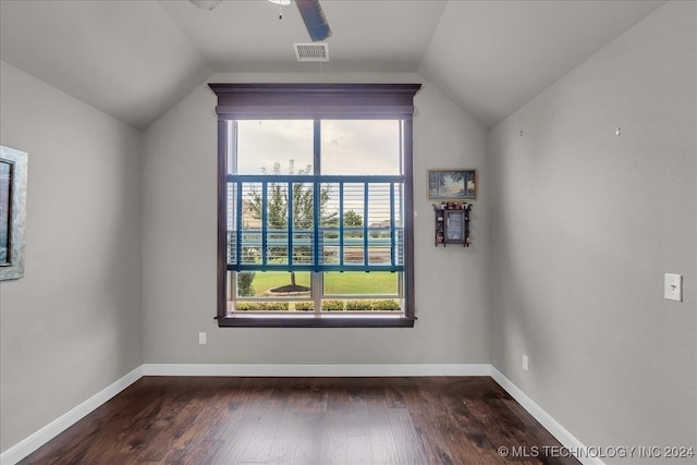 interior space featuring vaulted ceiling, dark hardwood / wood-style floors, and ceiling fan