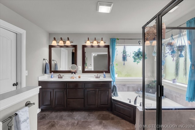 bathroom featuring independent shower and bath and vanity