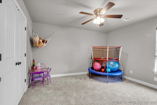 carpeted bedroom with ceiling fan