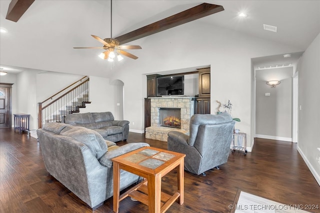 living room with high vaulted ceiling, a fireplace, beamed ceiling, ceiling fan, and dark hardwood / wood-style floors