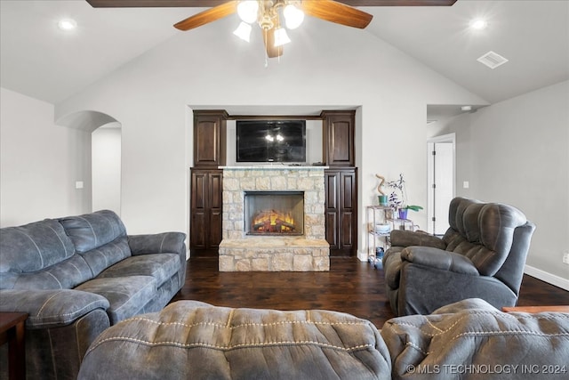 living room with a fireplace, vaulted ceiling, dark wood-type flooring, and ceiling fan