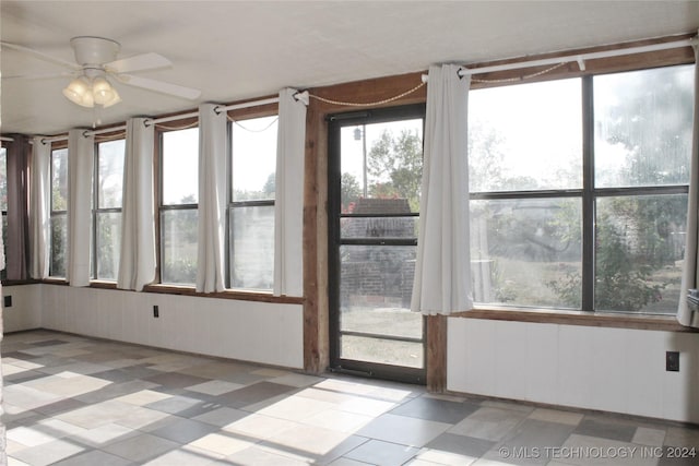 unfurnished sunroom featuring tile patterned floors