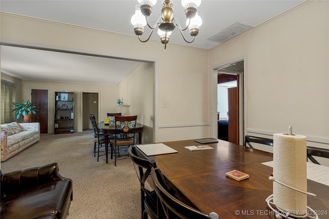 carpeted dining space featuring a notable chandelier and crown molding