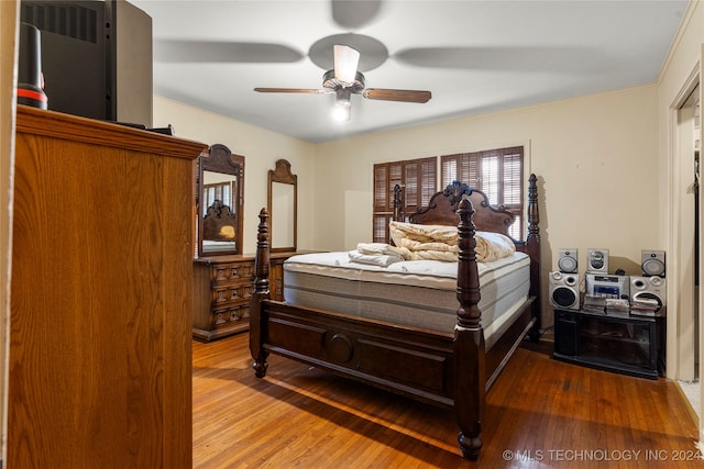 bedroom with wood-type flooring and ceiling fan