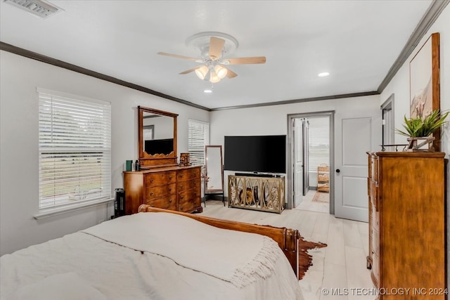 bedroom featuring crown molding, ceiling fan, and ensuite bathroom