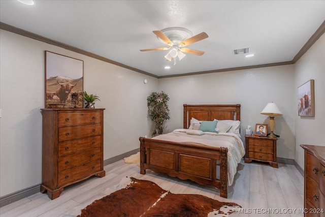 bedroom with light hardwood / wood-style floors, ceiling fan, and crown molding