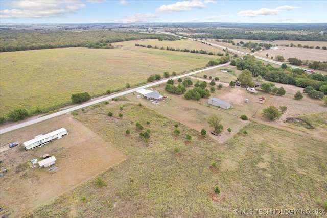 birds eye view of property featuring a rural view