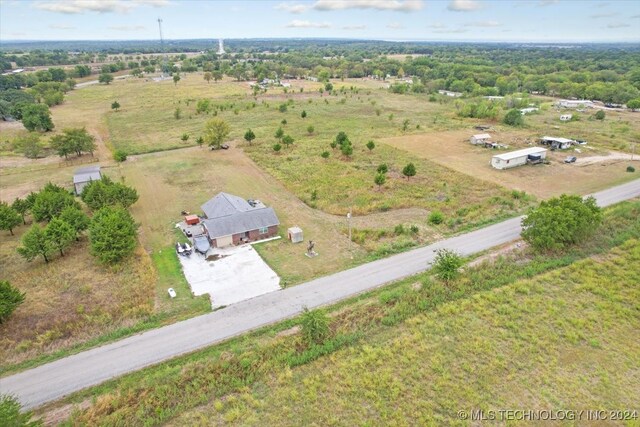 birds eye view of property with a rural view