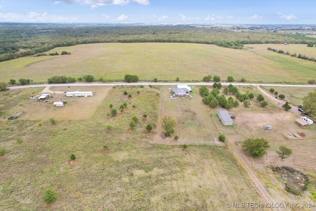 birds eye view of property featuring a rural view