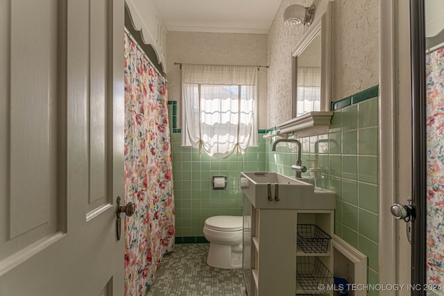 bathroom with curtained shower, tile walls, toilet, and tile patterned floors