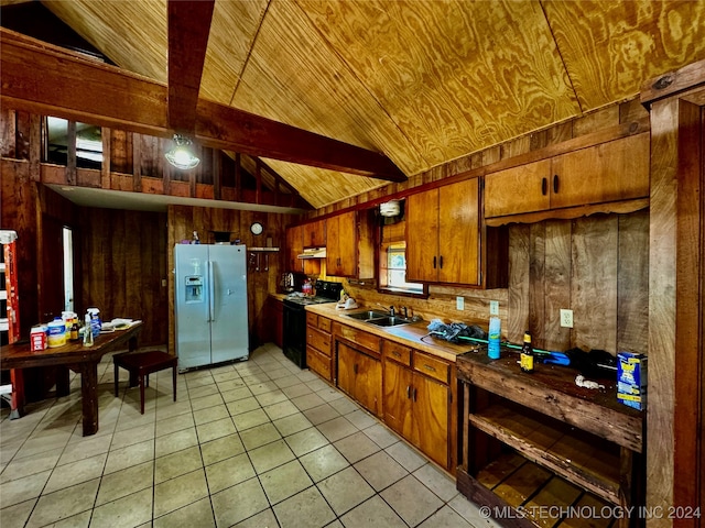 kitchen featuring vaulted ceiling, black range with electric stovetop, light tile patterned floors, stainless steel refrigerator with ice dispenser, and wooden walls