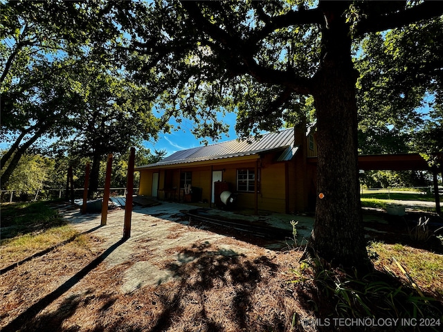 rear view of house with a patio