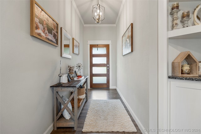 doorway featuring ornamental molding, dark wood-type flooring, and a notable chandelier