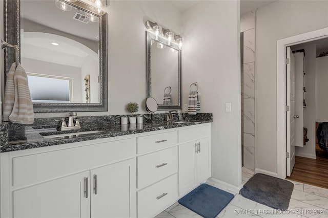 bathroom with vanity and hardwood / wood-style flooring