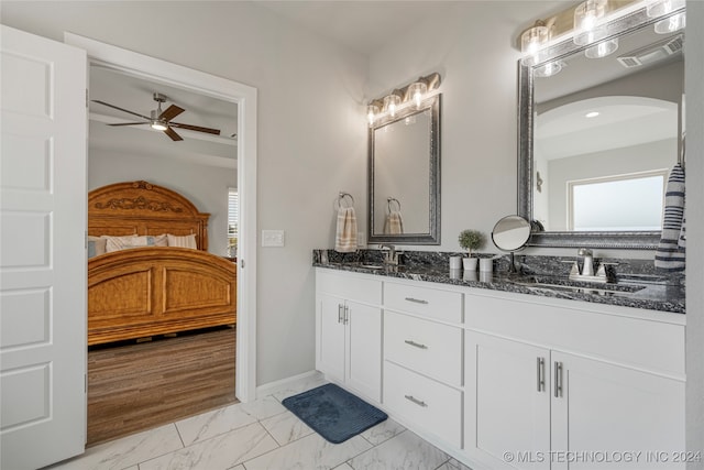 bathroom featuring vanity, ceiling fan, and hardwood / wood-style flooring