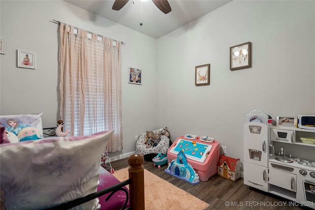 bedroom with baseboards, dark wood-style floors, and a ceiling fan