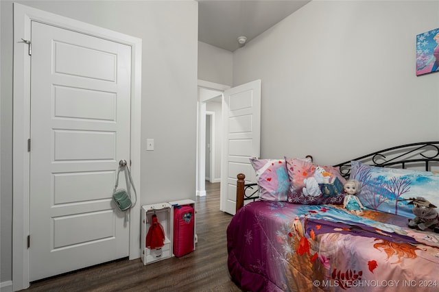 bedroom featuring dark hardwood / wood-style flooring