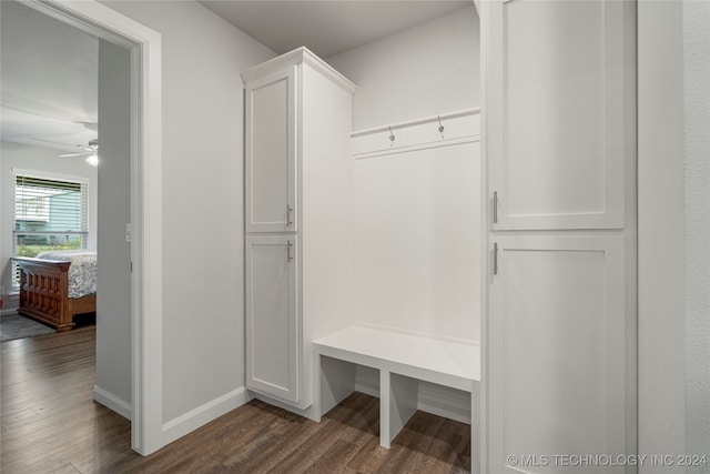 mudroom featuring baseboards, ceiling fan, and dark wood-style flooring