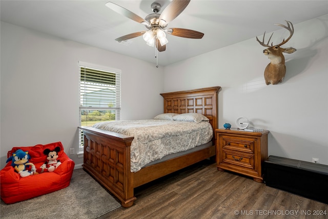 bedroom featuring ceiling fan and dark wood-type flooring