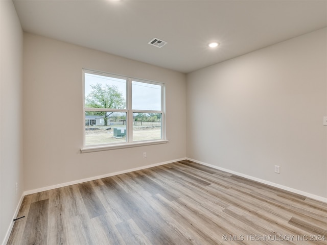 empty room with light wood-type flooring