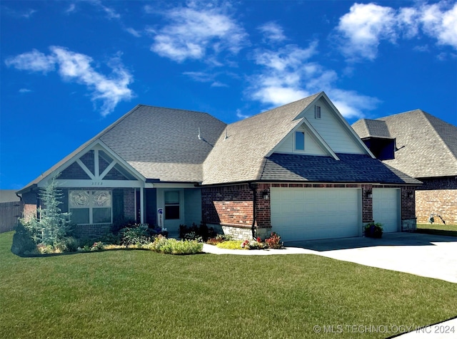 view of front facade with a front lawn and a garage