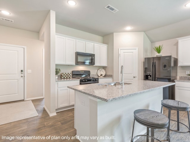 kitchen featuring a kitchen island with sink, black appliances, white cabinets, sink, and dark hardwood / wood-style flooring