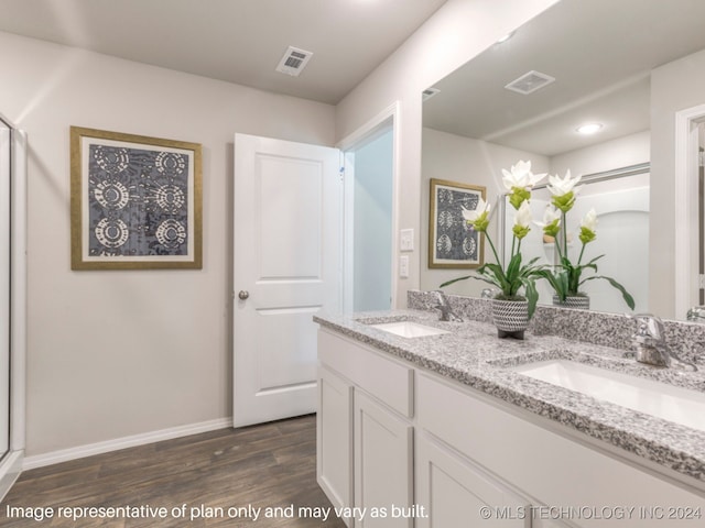 bathroom featuring vanity and hardwood / wood-style flooring