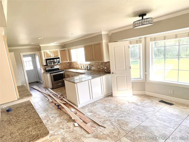 kitchen with light brown cabinets, ornamental molding, kitchen peninsula, backsplash, and stainless steel appliances