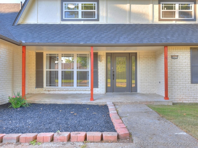 doorway to property featuring a porch