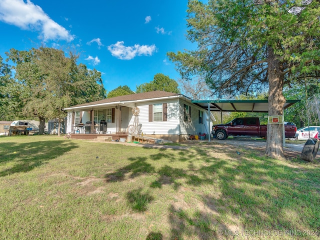 ranch-style home featuring a front lawn, a carport, and a porch