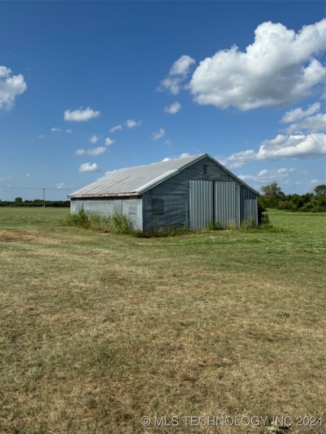 view of outdoor structure with a lawn