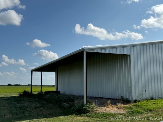 view of side of property featuring an outdoor structure