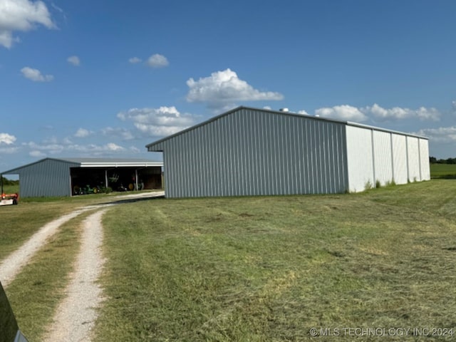 view of outdoor structure with a yard