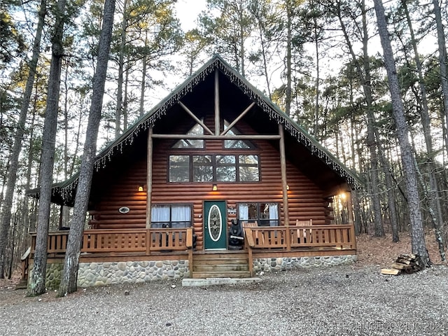 log cabin with a deck