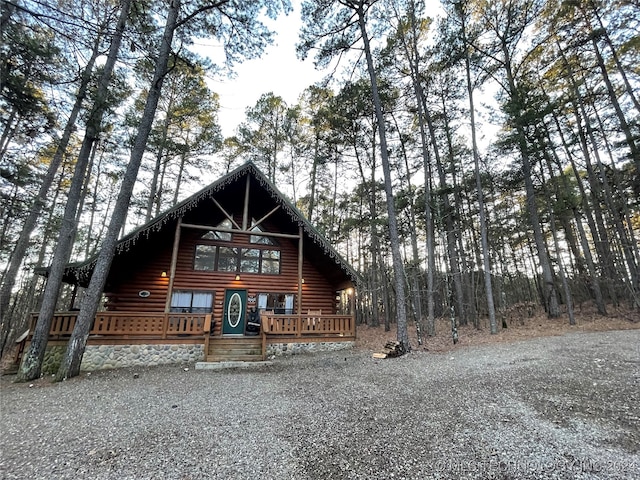 log-style house with a deck