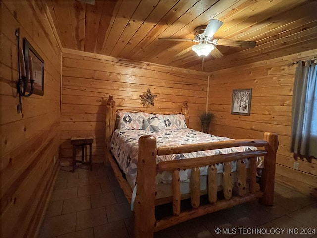 tiled bedroom featuring wooden walls, ceiling fan, and wooden ceiling