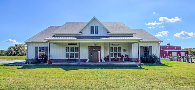 view of front of property with a front lawn and covered porch