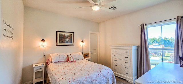 bedroom with ceiling fan and carpet