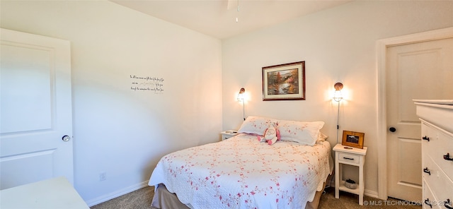 bedroom with dark colored carpet