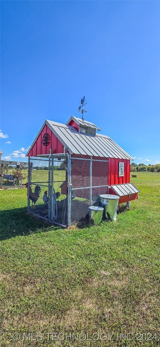 view of outbuilding with a lawn