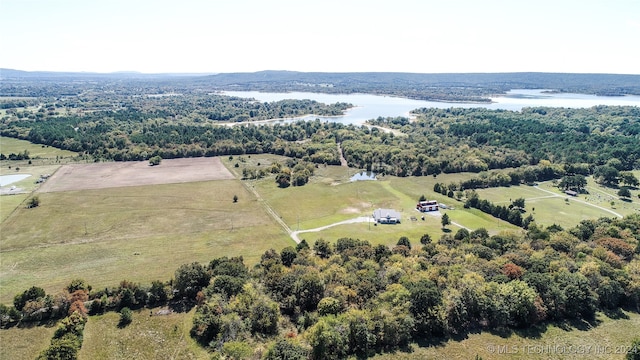 drone / aerial view featuring a water view and a rural view