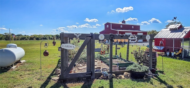 view of jungle gym featuring a lawn and an outbuilding