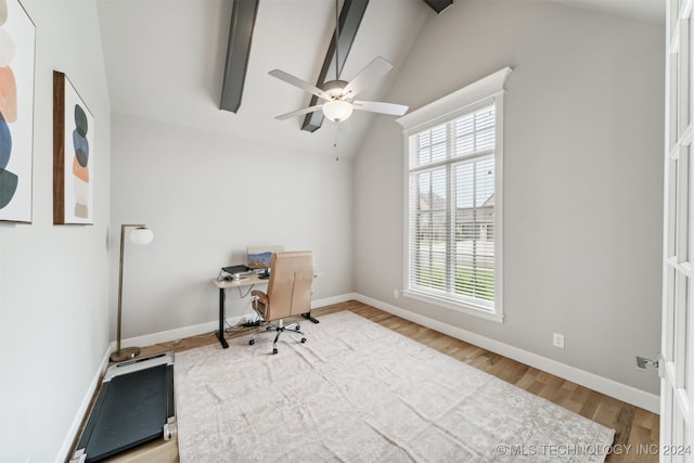 unfurnished office with light hardwood / wood-style floors, lofted ceiling with beams, and ceiling fan