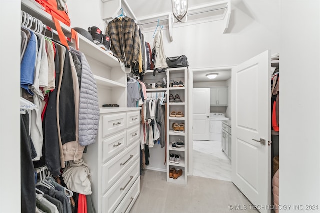 spacious closet featuring washer / dryer