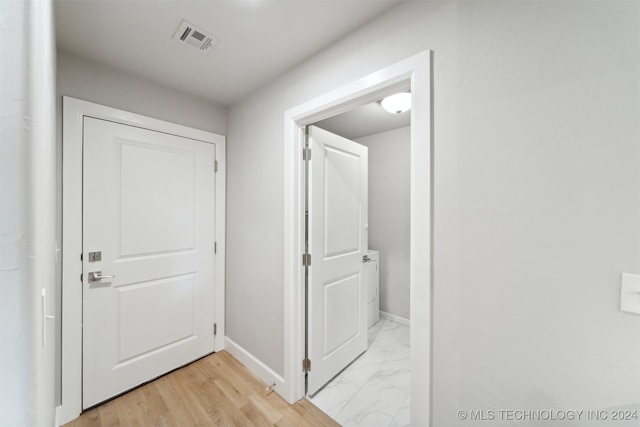 hallway featuring light hardwood / wood-style flooring