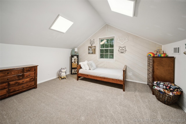 bedroom with light colored carpet and vaulted ceiling