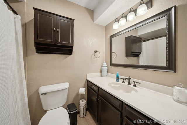 bathroom featuring vanity, toilet, and tile patterned floors